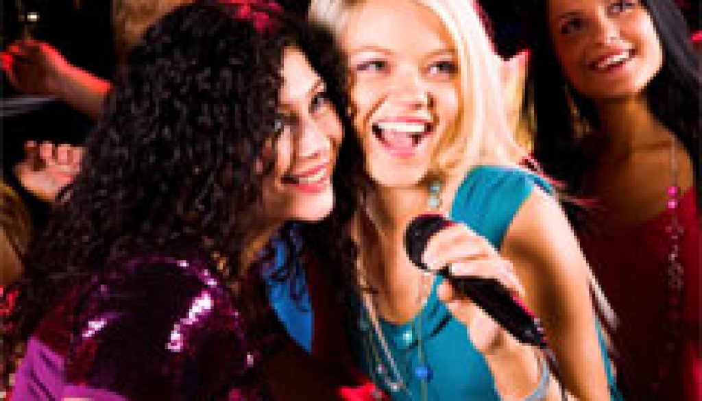 Photo of pretty girls with microphone singing in it